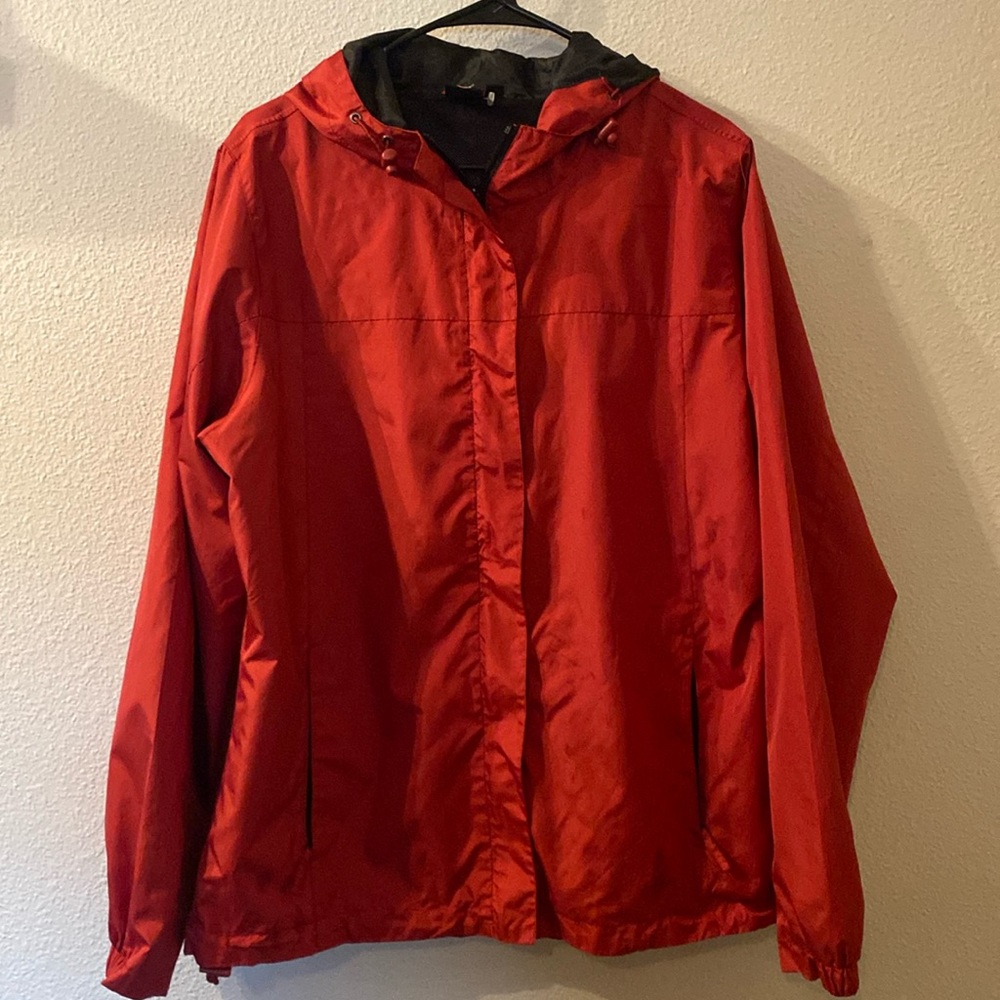 OS rain jacket that also folds into itself size XL